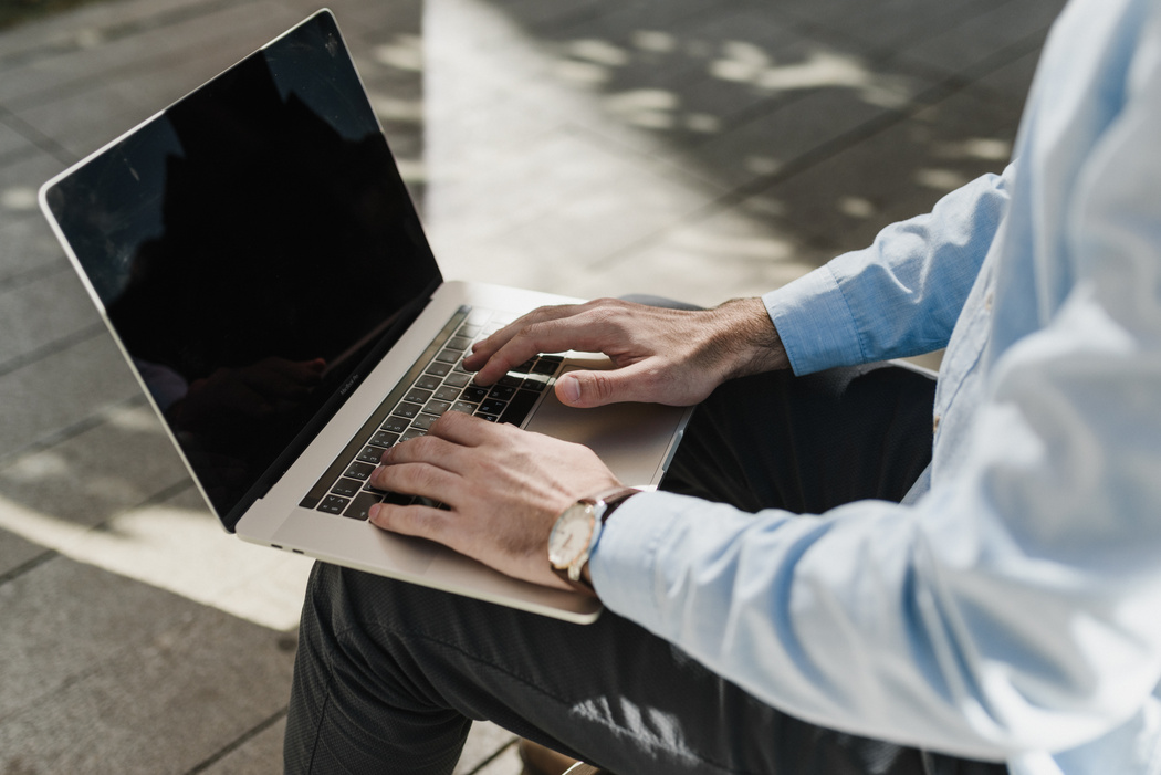 Crop Photo Of Man in Blue Long Sleeve Shirt Using Laptop